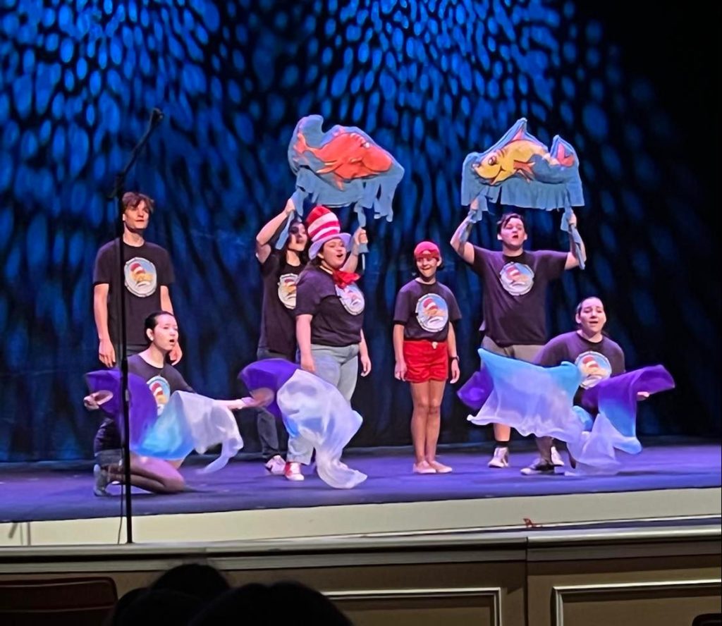 cast on stage performing Seussical