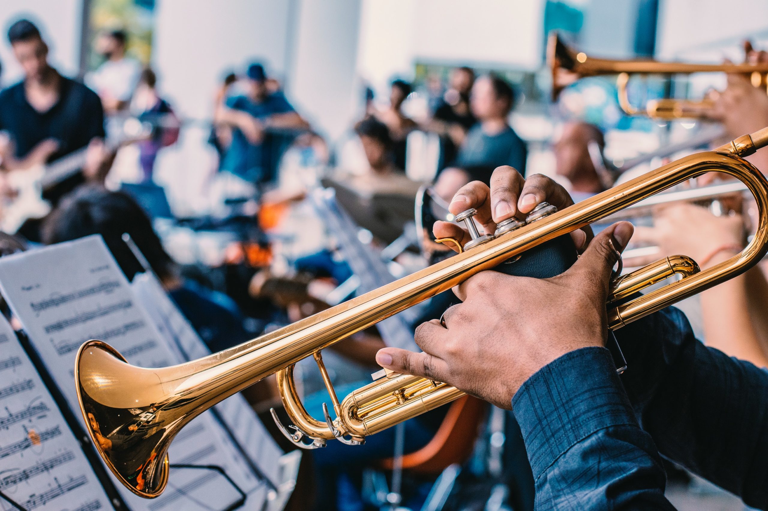 picture of a a trumpet playing in an orchestra